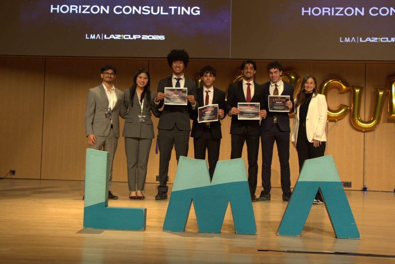 The LazCup 2026 award ceremony at the Laurier Marketing Association, teams on stage holding certificates.